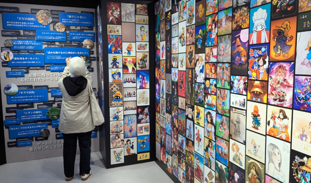 A photo of the back of someone taking a picture in the exhibiton. They are surrounded by walls of fanart and fan coomments