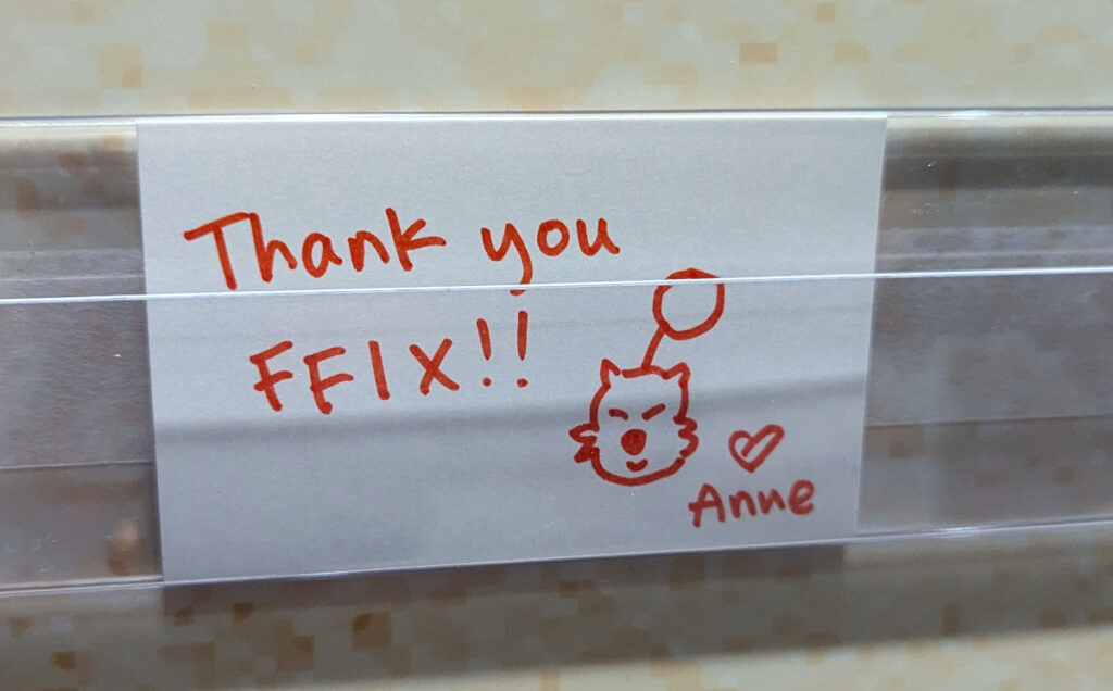 Closeup of my thank you note for the fan comment wall. It says "Thank you FFIX" with a little Moogle face and a signature that reads "Anne" with a heart